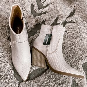 Cream snakeskin textured vegan express booties.
